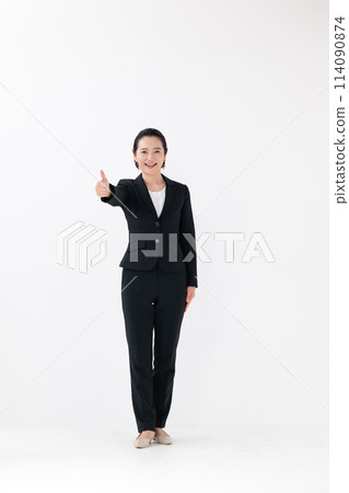 Business middle-aged woman standing thumbs up Business middle-aged woman standing thumbs up 114090874