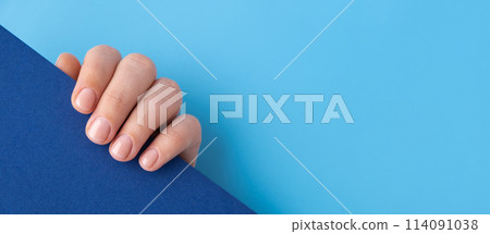 Pastel softness manicured nails on blue background. Mock up template copy space Woman showing her new manicure in colors of pastel palette. Simplicity decor fresh spring vibes earth-colored neutral Pastel softness manicured nails on blue background. Mock up template copy space Woman showing her new manicure in colors of pastel palette. Simplicity decor fresh spring vibes earth-colored neutral 114091038