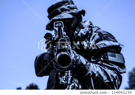 Special forces soldier aiming his rifle pointing aiming at objective. High quality colorized photo 114091234