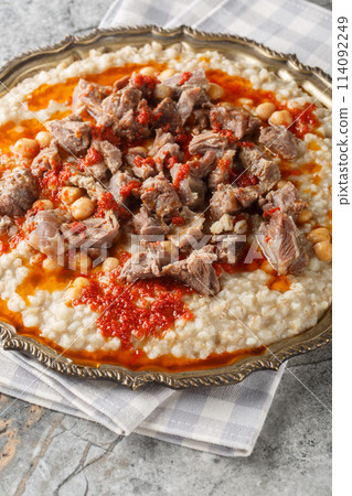 Lamb Keshkek Traditional Wheat and Mutton Stew closeup on the plate. Vertical 114092249