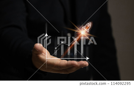 Man hand with stock market graph with rocket. Finance chart investment growth high. The currency trading economy strategy situation. Market and exchange analyzing data. 114092295