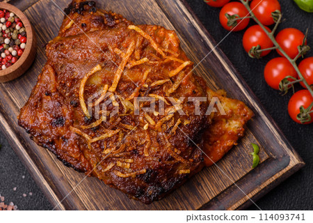 Delicious pork or beef ribs baked on the grill with salt, spices and herbs Delicious pork or beef ribs baked on the grill with salt, spices and herbs 114093741