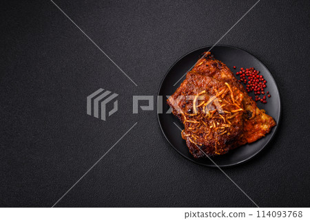 Delicious pork or beef ribs baked on the grill with salt, spices and herbs 114093768