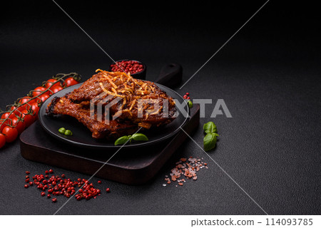 Delicious pork or beef ribs baked on the grill with salt, spices and herbs Delicious pork or beef ribs baked on the grill with salt, spices and herbs 114093785