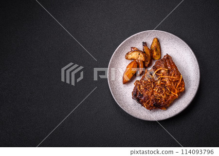 Delicious pork or beef ribs baked on the grill with salt, spices and herbs Delicious pork or beef ribs baked on the grill with salt, spices and herbs 114093796