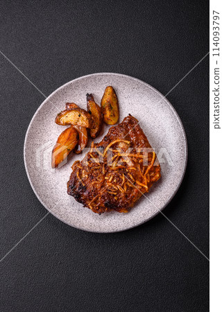 Delicious pork or beef ribs baked on the grill with salt, spices and herbs 114093797