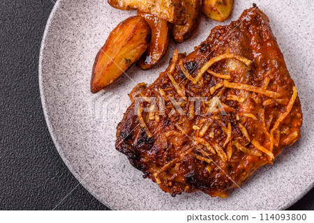 Delicious pork or beef ribs baked on the grill with salt, spices and herbs Delicious pork or beef ribs baked on the grill with salt, spices and herbs 114093800