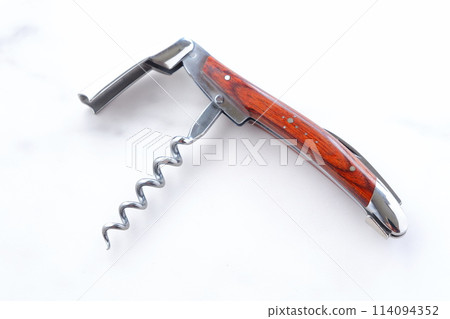 A sommelier knife for opening wine bottle corks A sommelier knife for opening wine bottle corks 114094352
