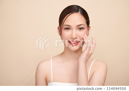 Beautiful young asian woman with clean fresh skin on beige background, Face care, Facial treatment, Cosmetology, beauty and spa, Asian women portrait. 114094508