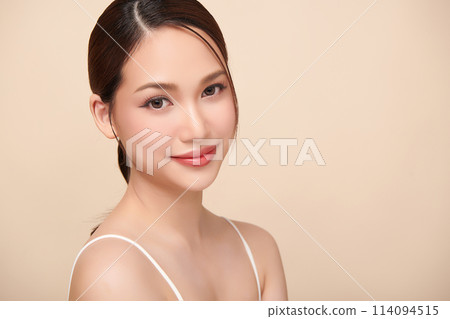 Beautiful young asian woman with clean fresh skin on beige background, Face care, Facial treatment, Cosmetology, beauty and spa, Asian women portrait. 114094515