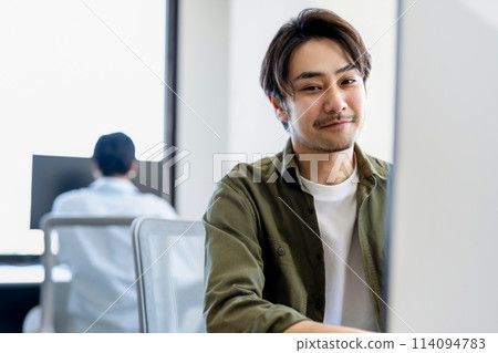 Businessman doing desk work Businessman doing desk work 114094783