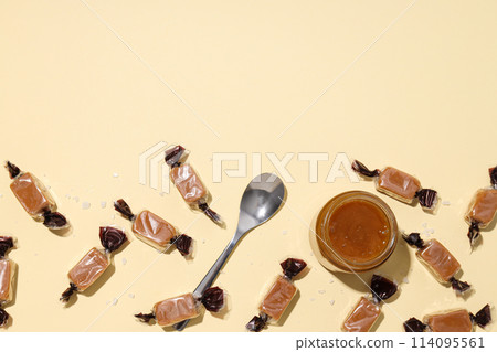 Salted caramel candies on a light background 114095561