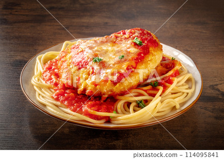 Chicken Parmesan, Italian pasta dish. Breaded chicken breast with cheese 114095841