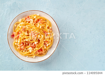 Carbonara pasta dish, traditional spaghetti with pancetta and cheese Carbonara pasta dish, traditional spaghetti with pancetta and cheese 114095844