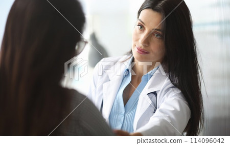 Adult caucasian doctor is sympathetic to patient. Adult caucasian doctor is sympathetic to patient. 114096042