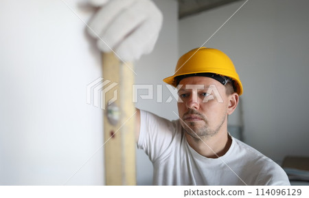 Male inspector in protective gloves hold building 114096129