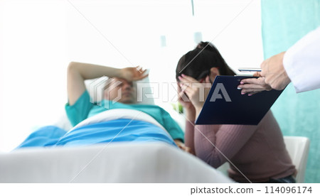 Female doctor brings documents crying with grief Female doctor brings documents crying with grief 114096174