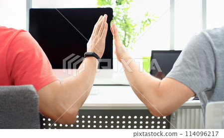 Two male hand in office hive five Two male hand in office hive five 114096217
