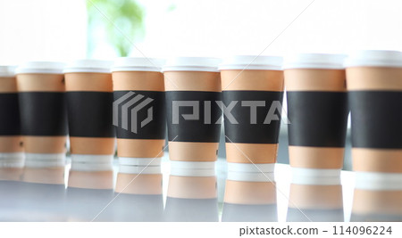 Line of paper cups standing at table Line of paper cups standing at table 114096224