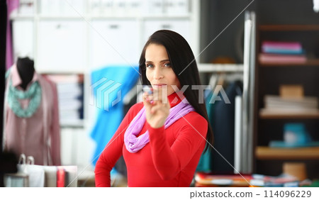 Joyful woman in workplace 114096229