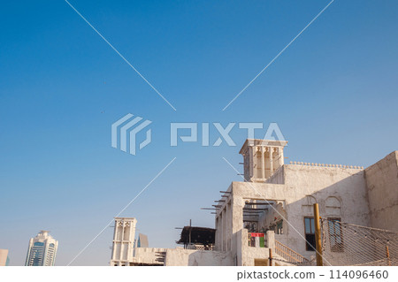 Old historic district in Dubai. traditional streets of old Dubai. Al Bastakiya district is also known as Al Fahidi Historical Neighbourhood or Al Seef 114096460
