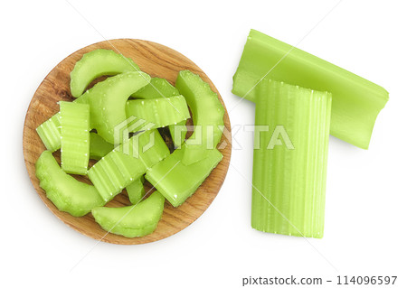 fresh celery in wooden bowl isolated on white background. Top view. Flat lay 114096597