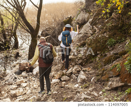 senior friends tourists outdoor adventure together on mediterranian sea landscape 114097005