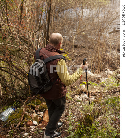senior friends tourists outdoor adventure together on mediterranian sea landscape 114097010