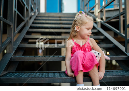 Child head with cochlear implant hearing aid. Hearing aid and medicine innovating technology and diversity Inclusion and people with disability concept. Copy space 114097901