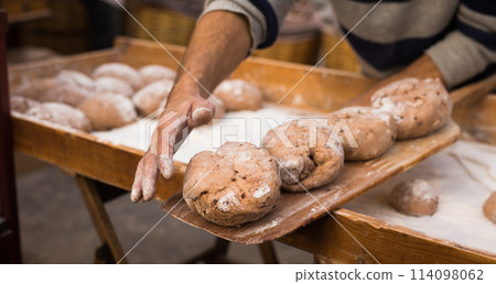 Yeast dough in the form of loaves waiting to be cooked 114098062
