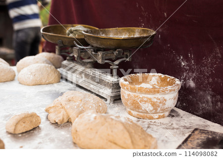 Male hands knead yeast dough for baking bread Male hands knead yeast dough for baking bread 114098082