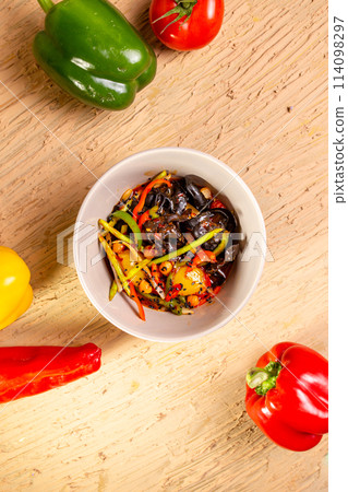 Colorful vegetable salad with tomatoes, peppers, and cucumbers Colorful vegetable salad with tomatoes, peppers, and cucumbers 114098297