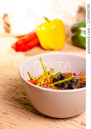 Colorful vegetable salad with tomatoes, peppers, and cucumbers Colorful vegetable salad with tomatoes, peppers, and cucumbers 114098298