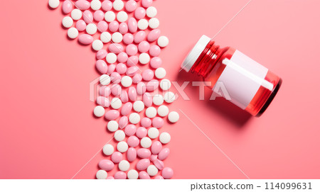 White pink pills, capsules and vitamins in a jar on a pink background. 114099631