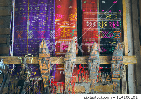 Colorful Ulos fabrics showcasing indigenous ethnic design and intricate patterns of the Batak people of North Sumatra Indonesia, on display for sale in the local market Colorful Ulos fabrics showcasing indigenous ethnic design and intricate patterns of the Batak people of North Sumatra Indonesia, on display for sale in the local market 114100101