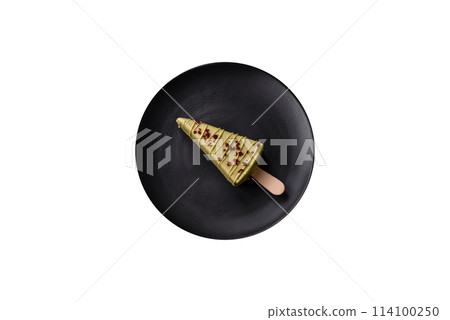 Delicious sweet cheesecake with fruits covered with icing with a wooden stick 114100250