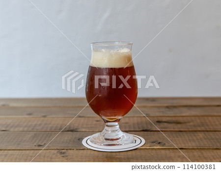 Craft beer, beer by the glass, dark beer Craft beer, beer by the glass, dark beer 114100381