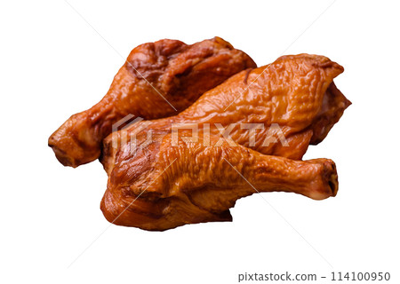 Delicious chicken legs baked on the grill with salt, spices and herbs 114100950