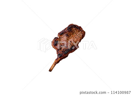 Delicious juicy beef steak on the bone, tomahawk with salt, spices and herbs 114100987