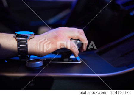 Selector automatic transmission with leather in the interior of a modern expensive car. The background is blurred. Black and brown leather car. Selector automatic transmission with leather in the interior of a modern expensive car. The background is blurred. Black and brown leather car. 114101183