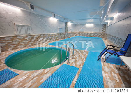 Indoor swimming pool with water chair for leisure and recreation 114101254