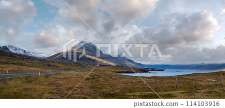 Highway road and mountain view during auto trip in Iceland. Spectacular Icelandic landscape with  scenic nature 114103916