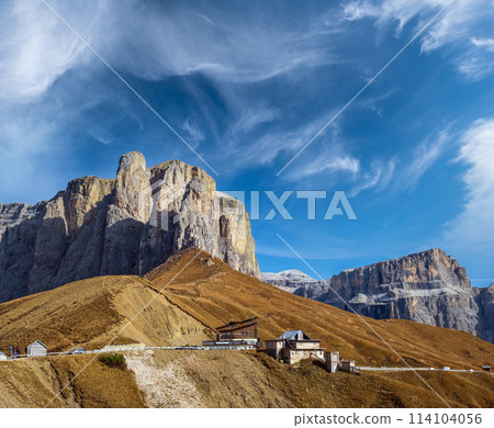Autumn alpine Dolomites rocky  mountain scene, Sudtirol, Italy. Peaceful view near Sella Pass. 114104056