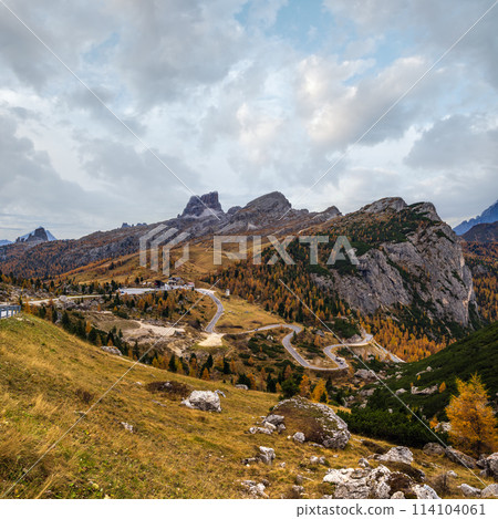 Overcast morning autumn alpine Dolomites mountain scene. Peaceful view near Valparola and Falzarego Path, Belluno, Italy. Overcast morning autumn alpine Dolomites mountain scene. Peaceful view near Valparola and Falzarego Path, Belluno, Italy. 114104061