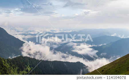 Summer misty and cloudy morning mountain tops with low clouds. Marmaros Carpathian, Ukraine. Summer misty and cloudy morning mountain tops with low clouds. Marmaros Carpathian, Ukraine. 114104078