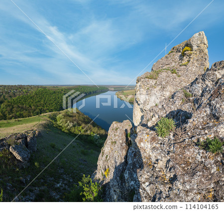 Amazing spring view on the Dnister River Canyon with picturesque rocks, fields, flowers. This place named Shyshkovi Gorby, Nahoriany, Chernivtsi region, Ukraine. Amazing spring view on the Dnister River Canyon with picturesque rocks, fields, flowers. This place named Shyshkovi Gorby, Nahoriany, Chernivtsi region, Ukraine. 114104165