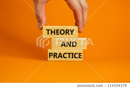 Theory and practice symbol. Wooden blocks with words 'Theory and practice' on a beautiful orange background. Businessman hand. Business, theory and practice concept. Copy space. Theory and practice symbol. Wooden blocks with words 'Theory and practice' on a beautiful orange background. Businessman hand. Business, theory and practice concept. Copy space. 114104376