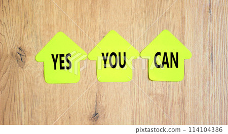 Motivational and Yes you can symbol. Concept words Yes you can on beautiful yellow paper houses. Beautiful wooden table wooden background. Business motivational and Yes you can concept. Copy space. 114104386