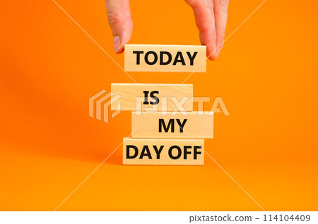 Today is my day off symbol. Concept words Today is my day off on wooden blocks. Businessman hand. Beautiful orange table orange background. Today is my day off business concept. Copy space. Today is my day off symbol. Concept words Today is my day off on wooden blocks. Businessman hand. Beautiful orange table orange background. Today is my day off business concept. Copy space. 114104409