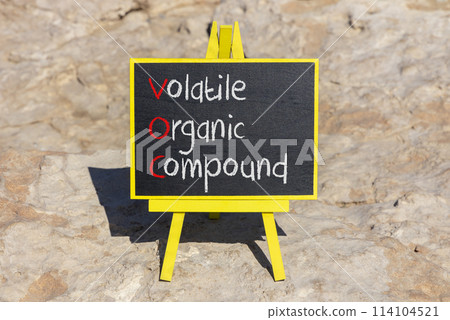 VOC volatile organic compound symbol. Concept words VOC volatile organic compound on beautiful yellow blackboard. Beautiful stone background. Business VOC volatile organic compound concept. Copy space 114104521